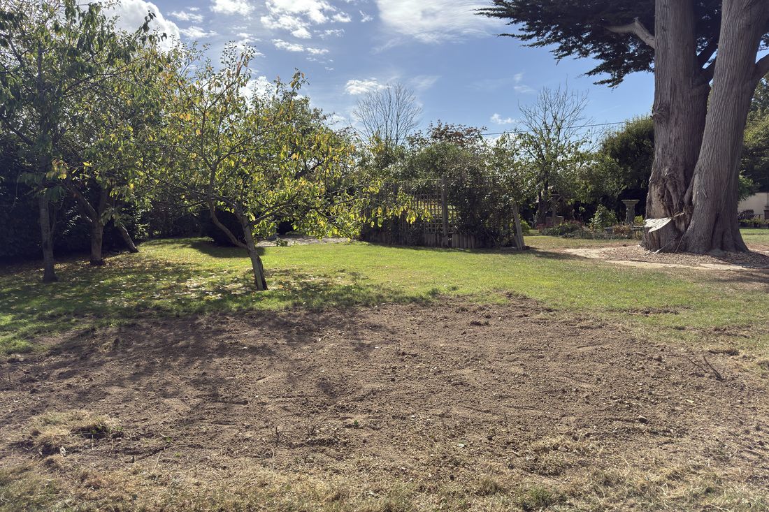 The same lawn with the stumps removed and the ground levelled